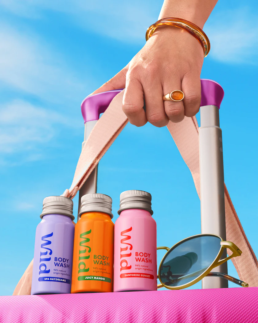 Caption: a person holding a pair of scissors and a pair of sunglasses