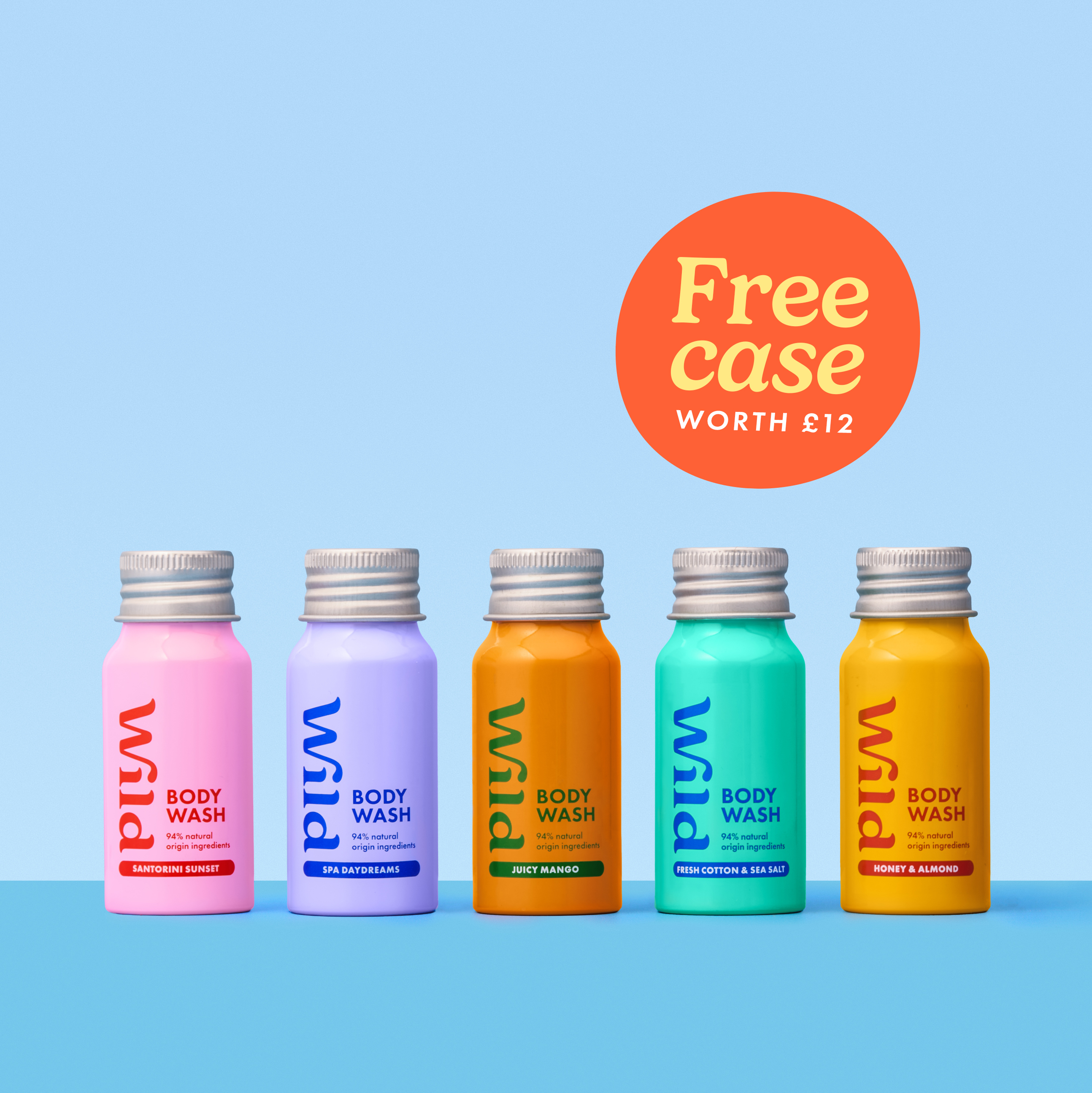 Caption: a group of five bottles of fruit juice