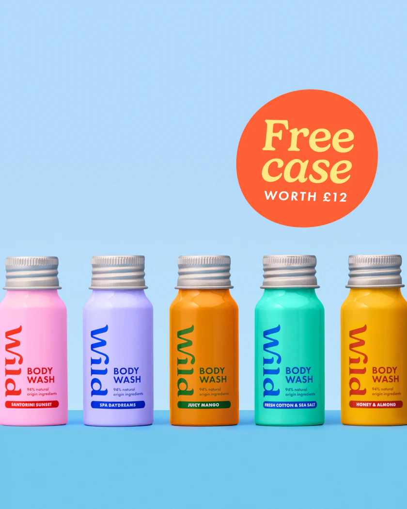 Caption: a group of five bottles of fruit juice