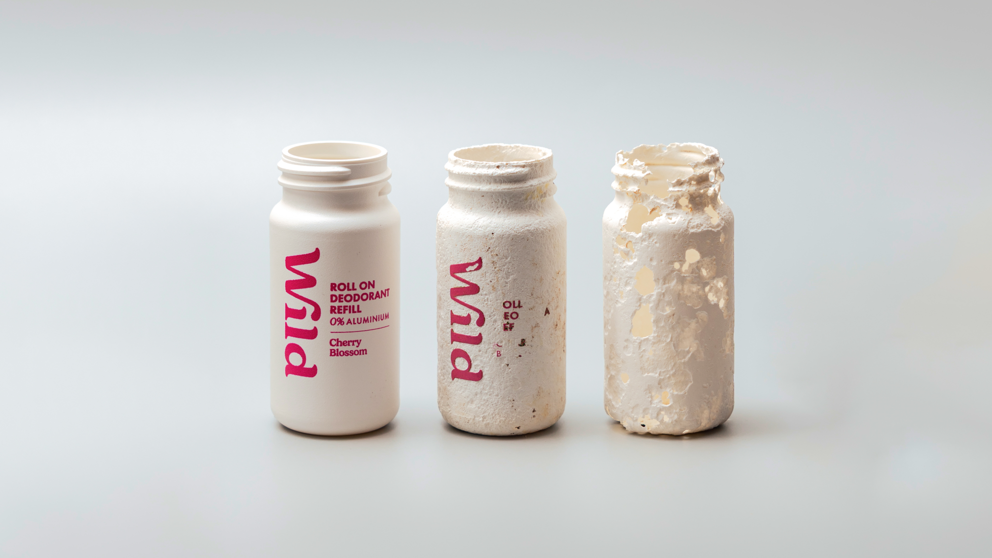 Caption: three empty bottles sitting next to each other