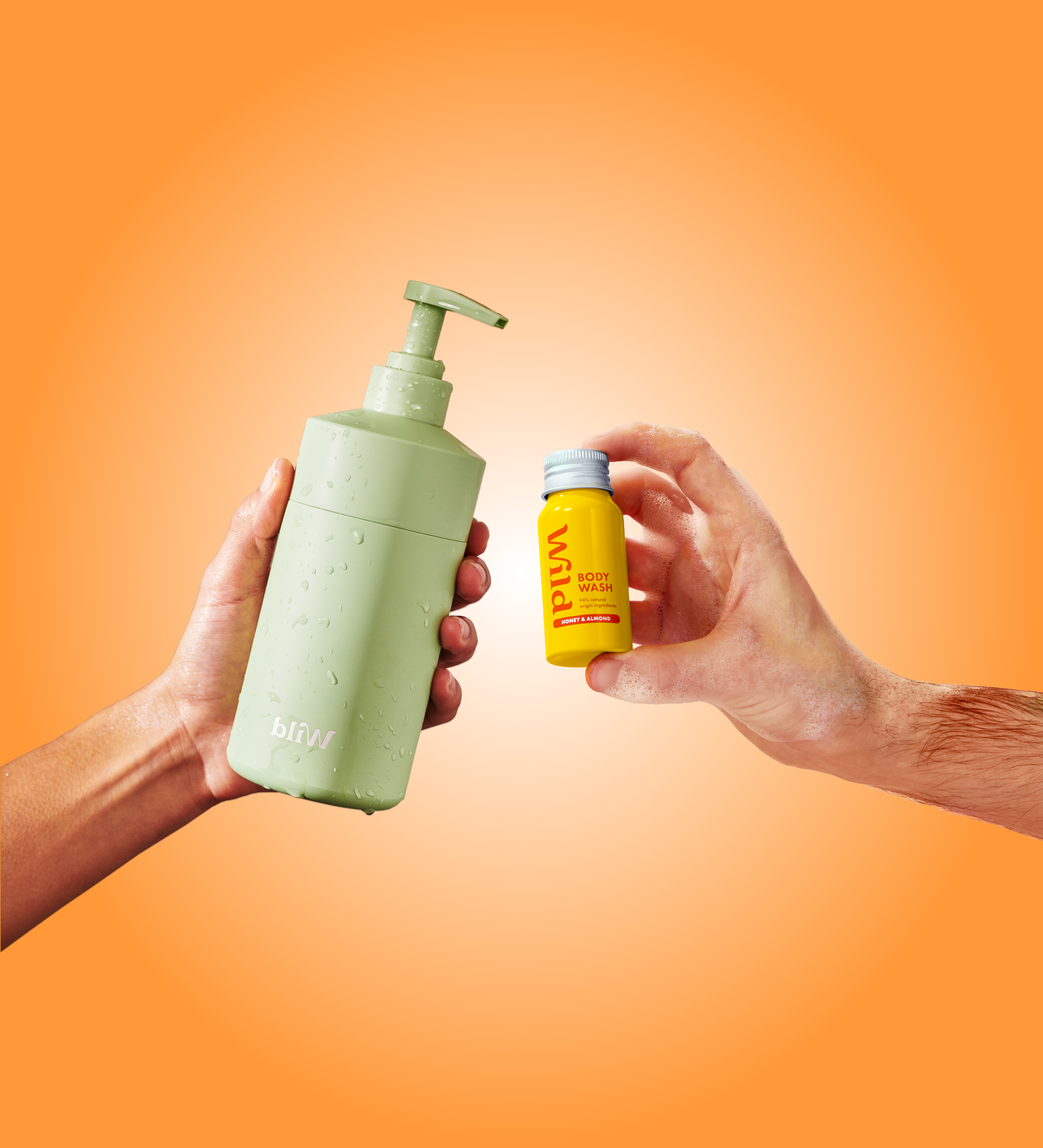Caption: two hands holding a bottle of soap and a hand sanitizer