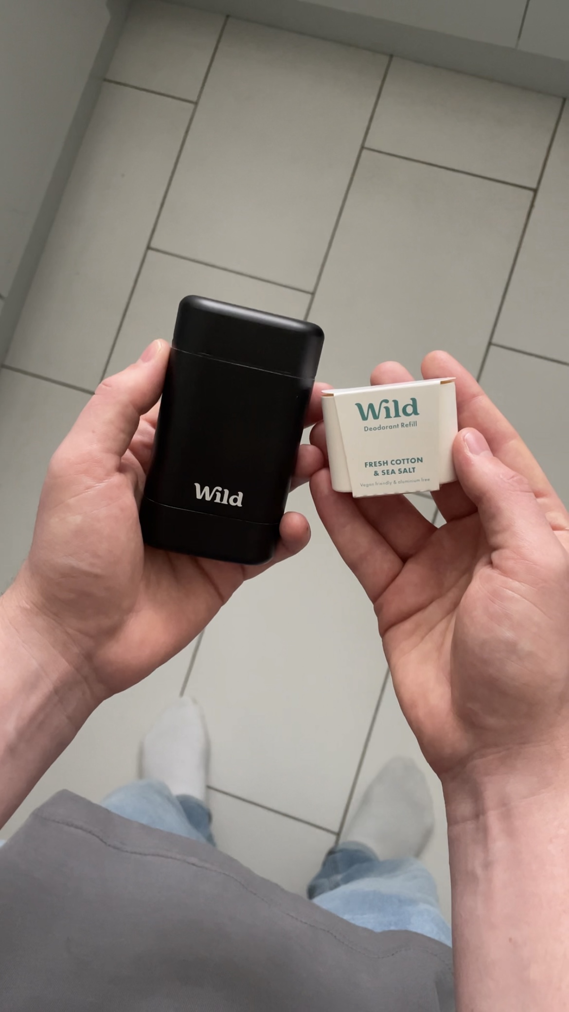 Caption: a person holding a cell phone in their hands