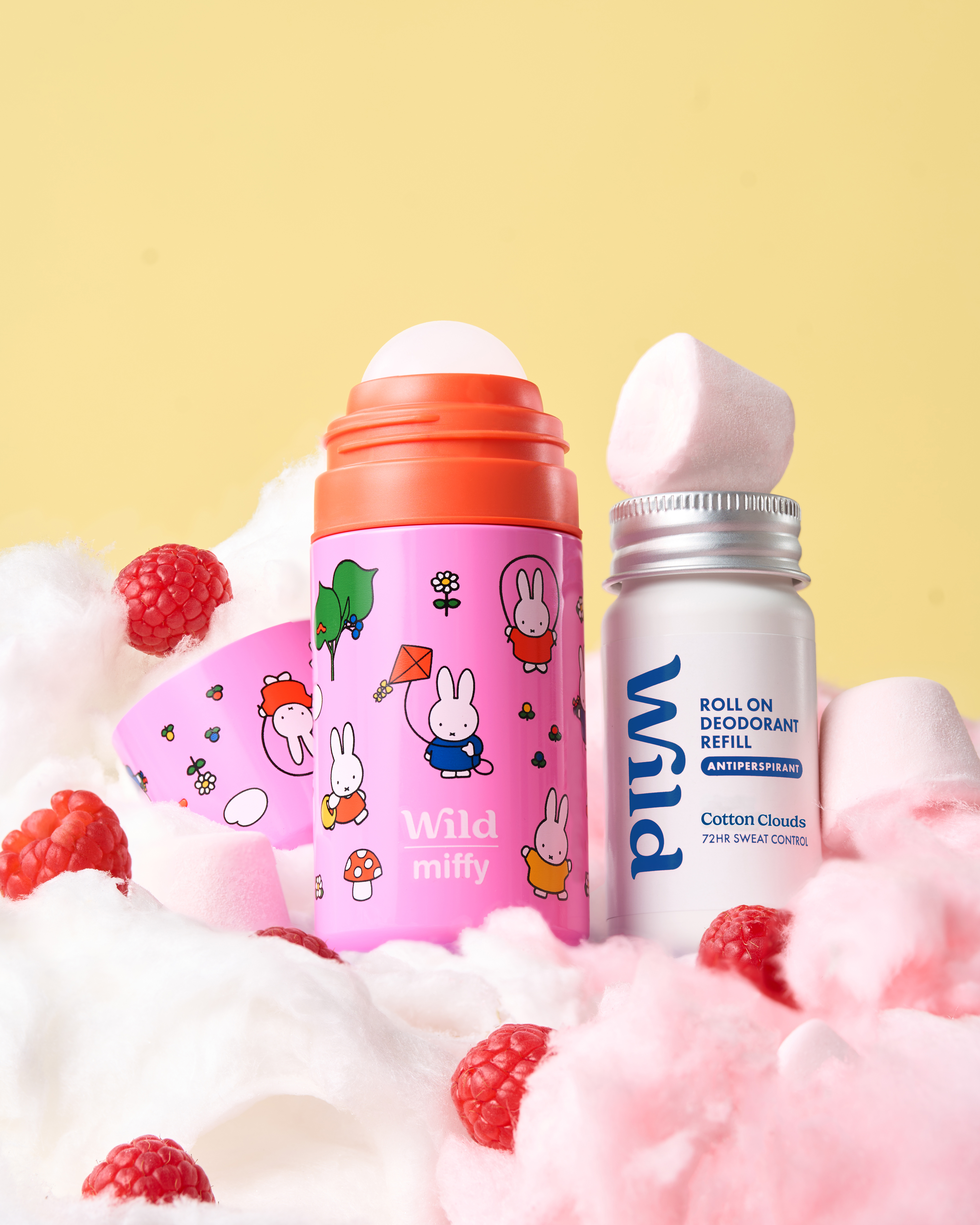 Caption: a bottle of vitamin water and a bottle of baby milk on a bed of cotton