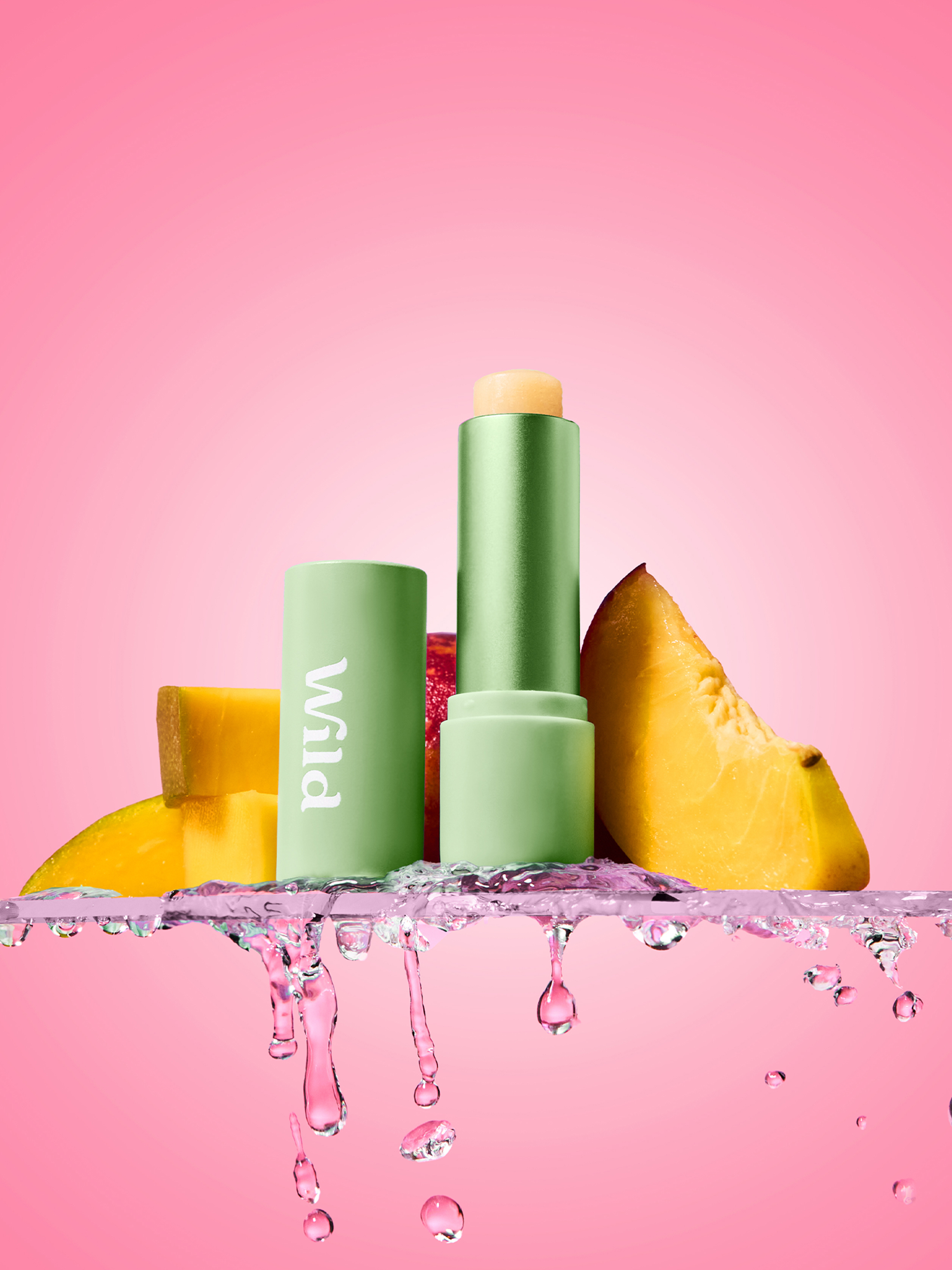 Caption: a pink background with a lipstick and some fruit