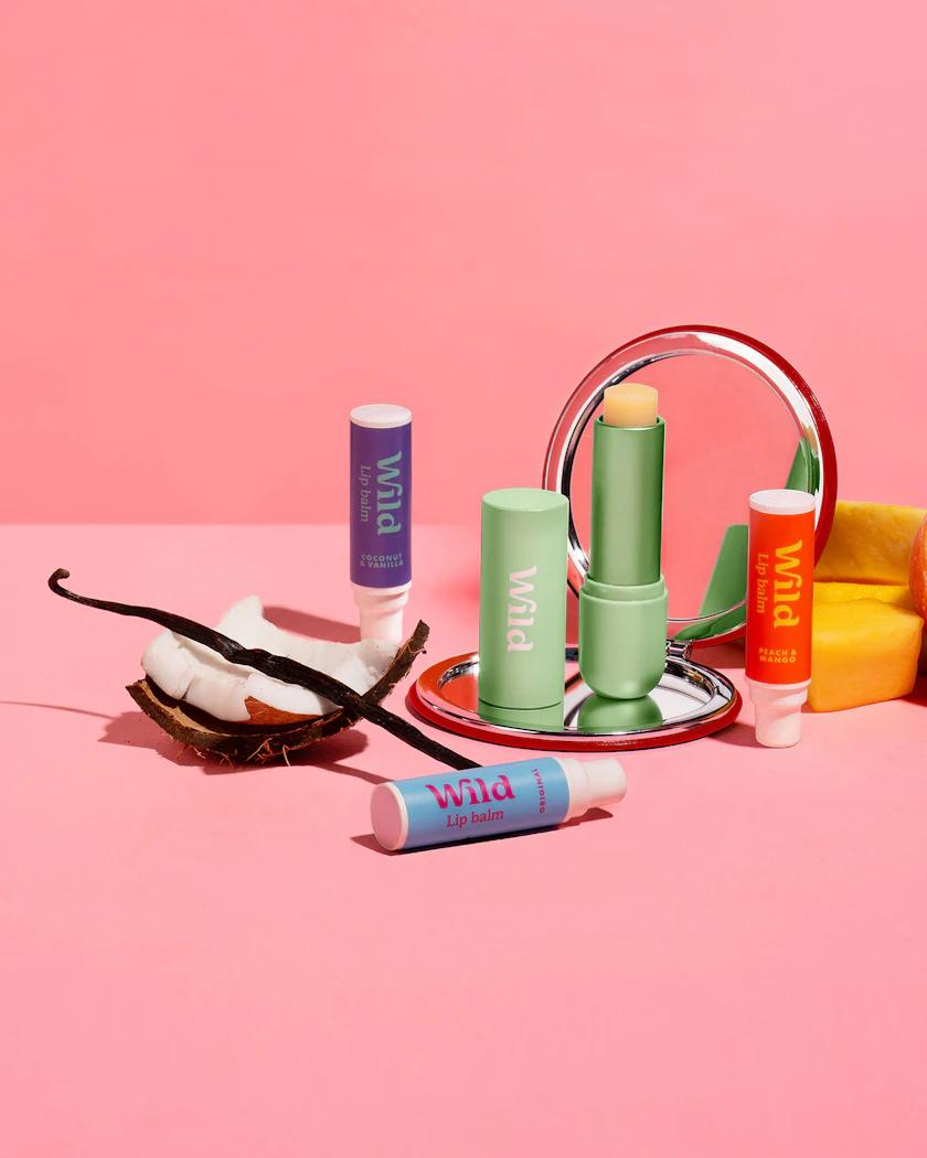 Caption: a pink background with various items on a plate