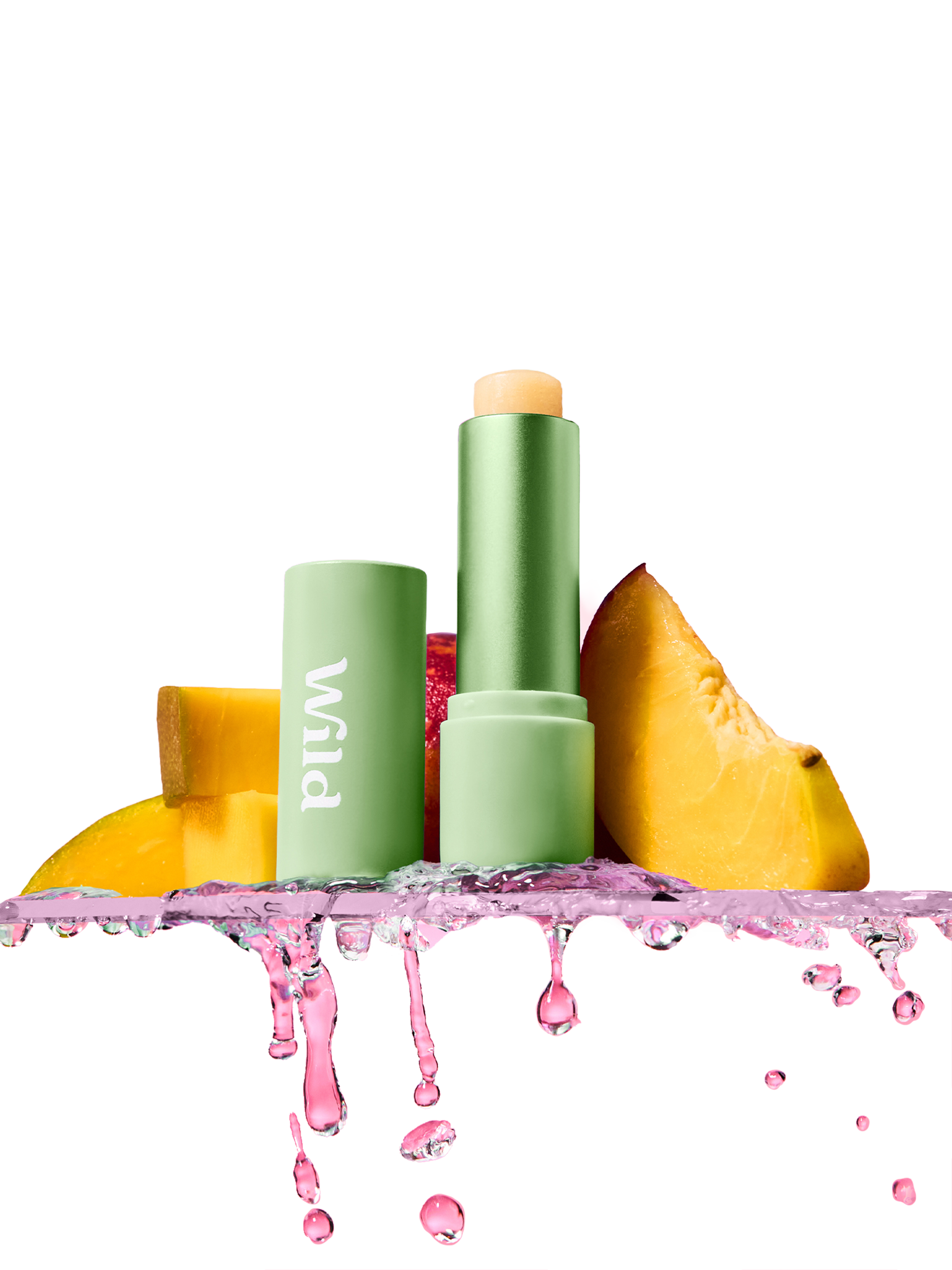 Caption: a pink background with a green tube and some fruit