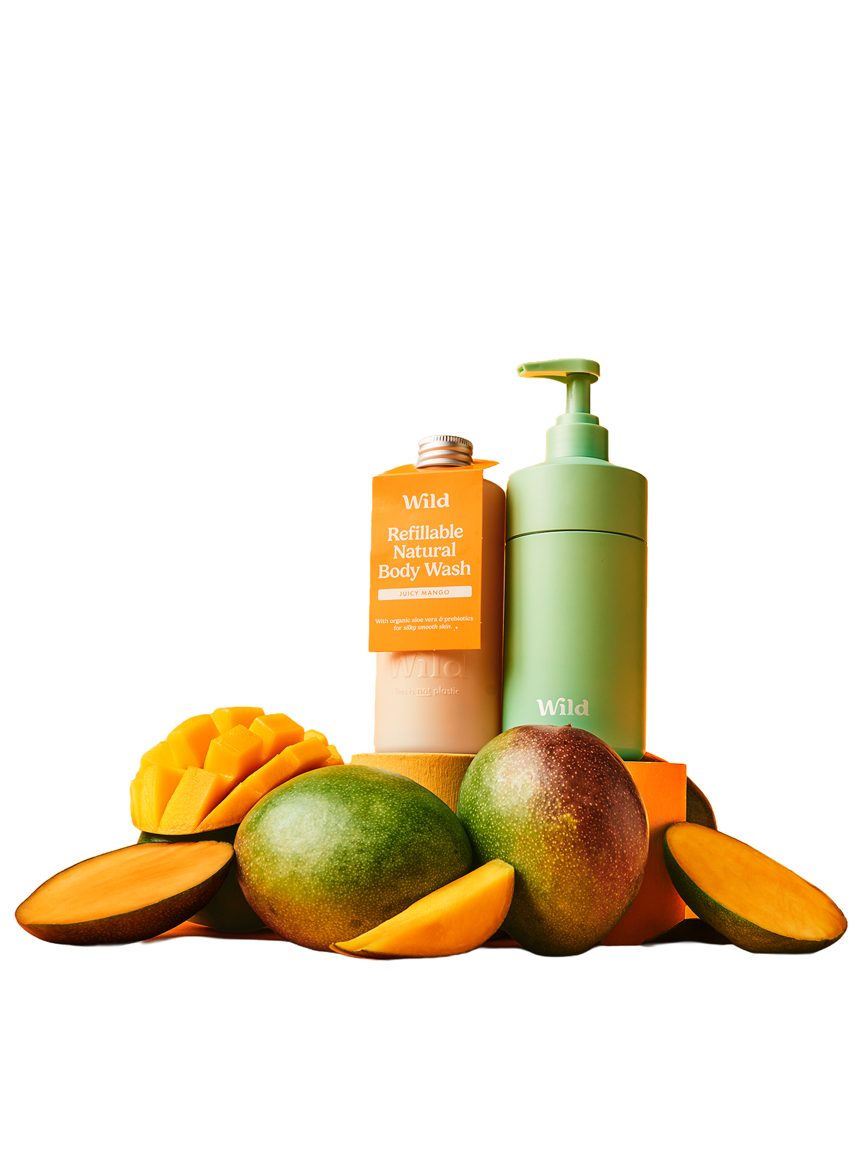 Caption: a bottle of lotion sitting next to a pile of fruit