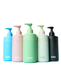 Caption: a set of four different colored bottles