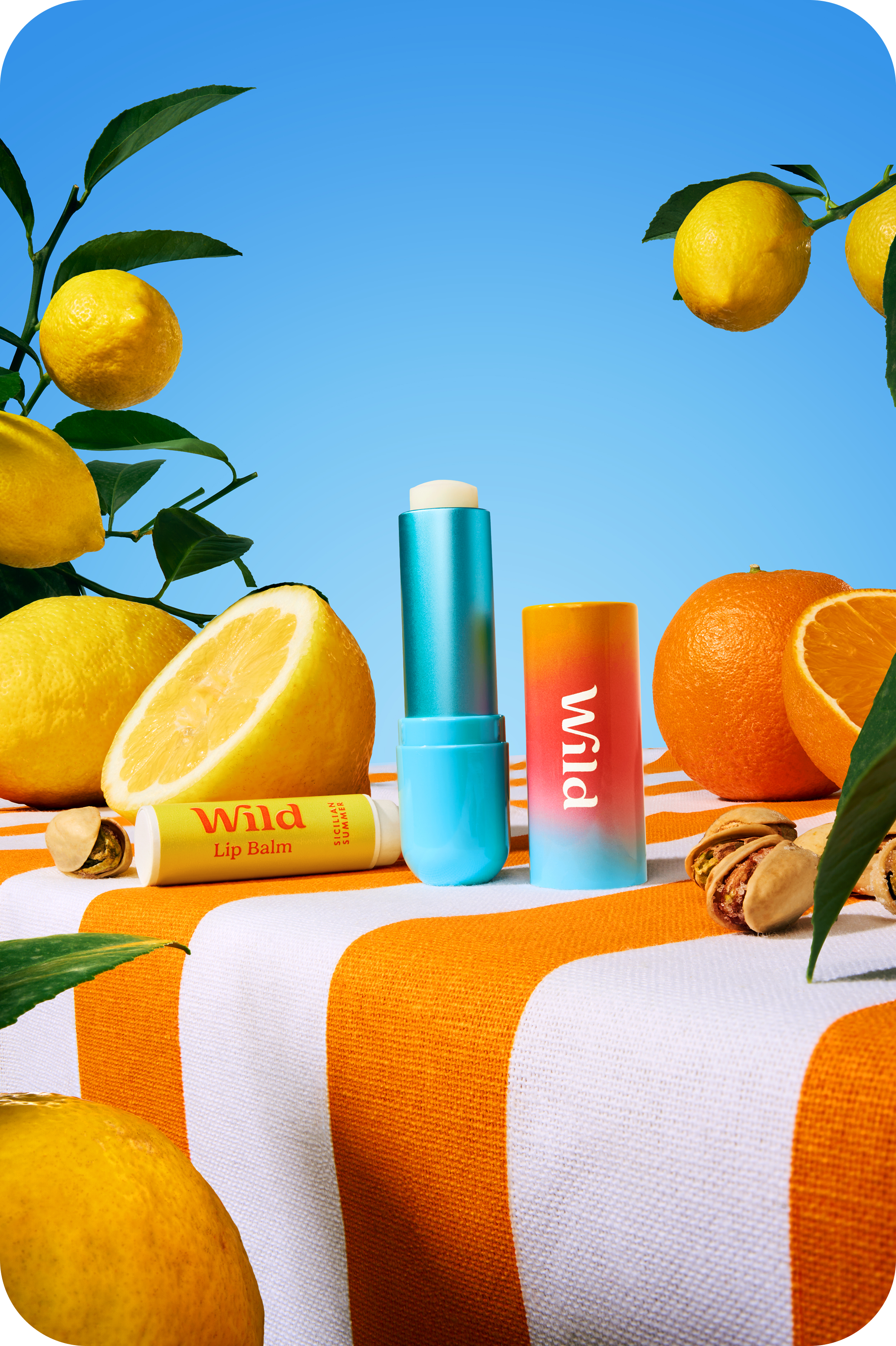 Caption: a table topped with oranges and a tube of lip balm