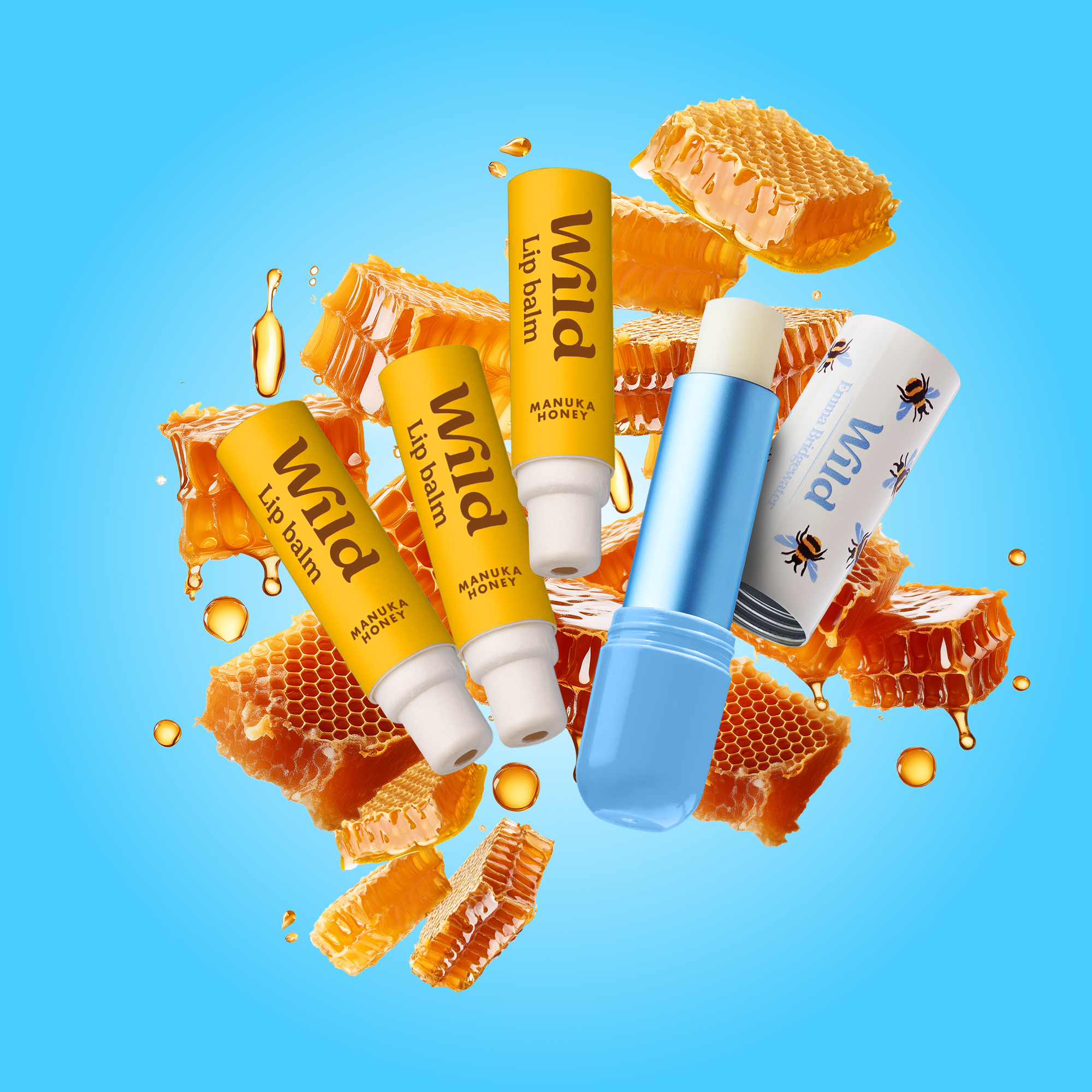 Caption: a blue bottle of lip balm surrounded by honey and honeycombs