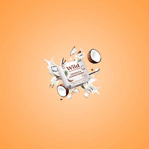 Caption: an orange background with a white tube of toothpaste and coconuts