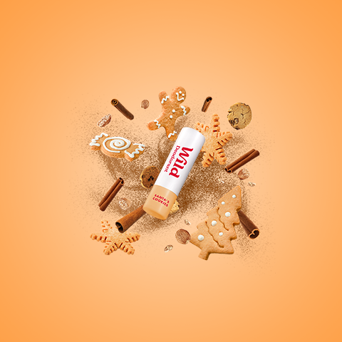 Caption: a bottle of nut butter surrounded by cookies and cookies
