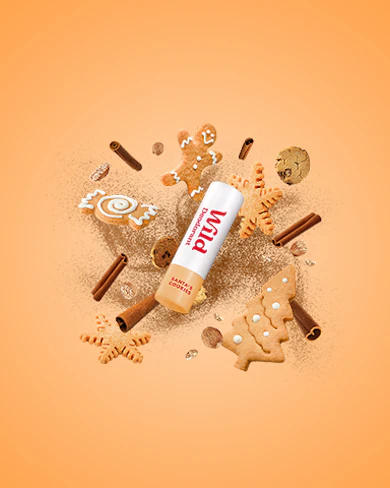 Caption: a bottle of nut butter surrounded by cookies and cookies
