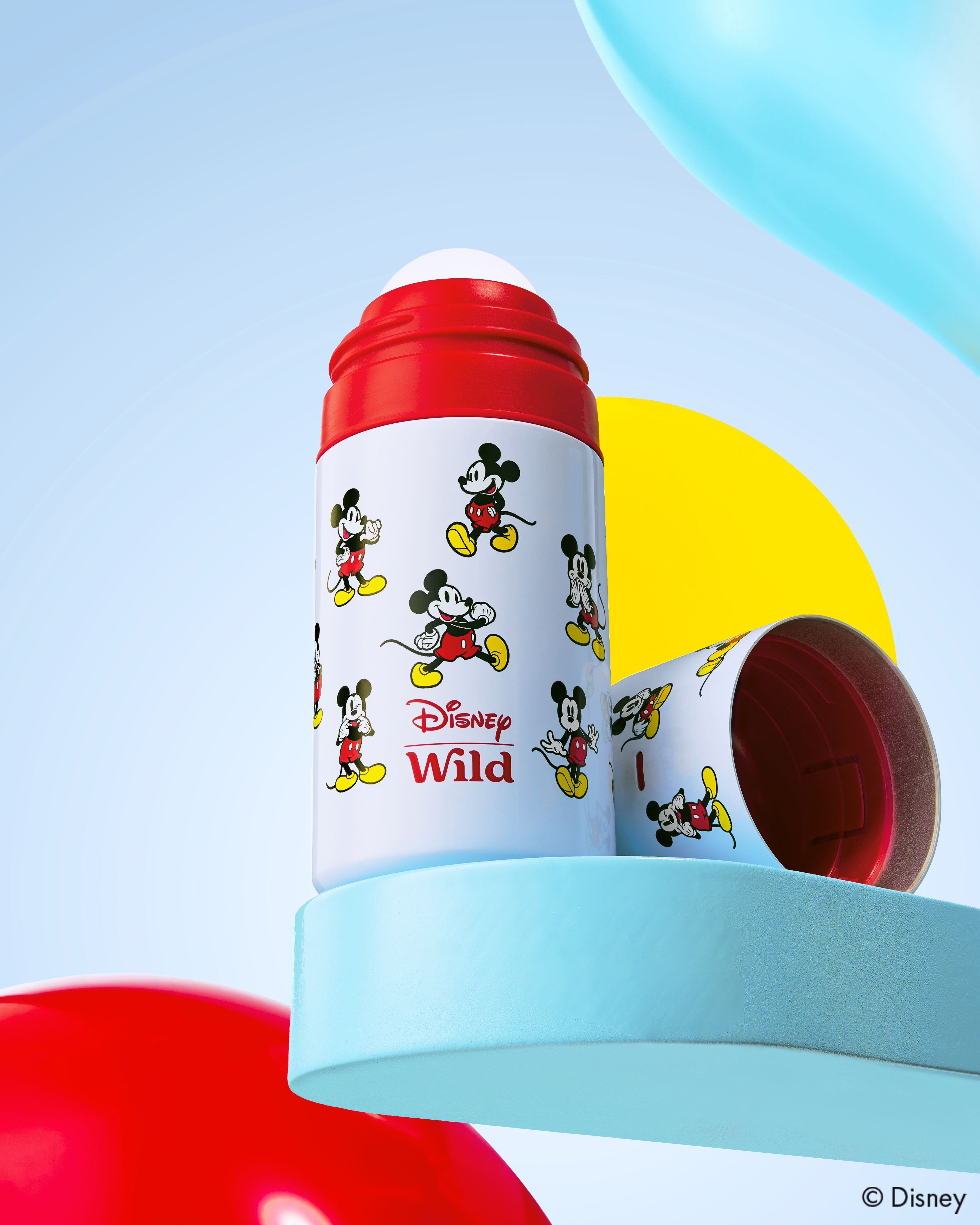 Caption: a red and white bottle with mickey mouse on it