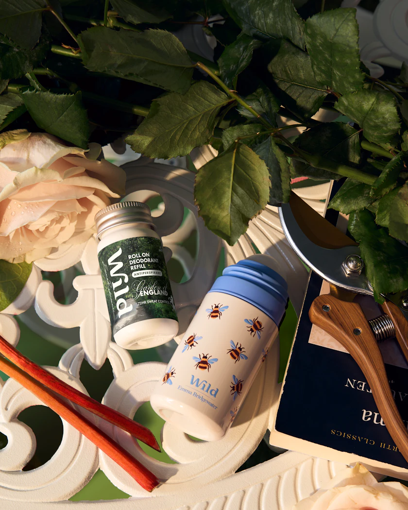 Caption: a white tray topped with a bottle of lotion and a pair of scissors