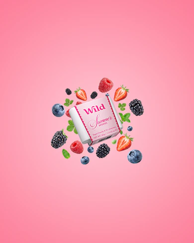 Caption: a pink background with berries, strawberries and a bar of soap