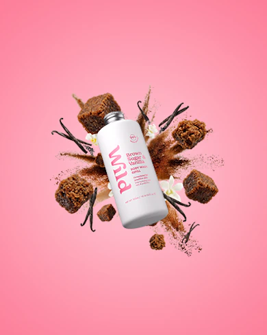 Caption: a pink background with a bottle of body lotion on top of it