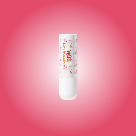 Caption: a tube of lip balm on a pink background