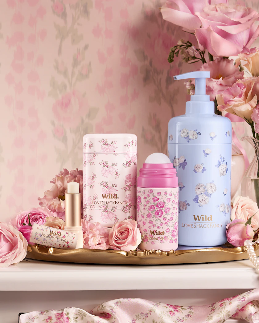 Caption: a white dresser topped with lots of pink flowers