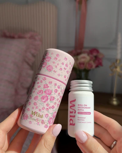 Caption: a person holding a jar of pills in their hands