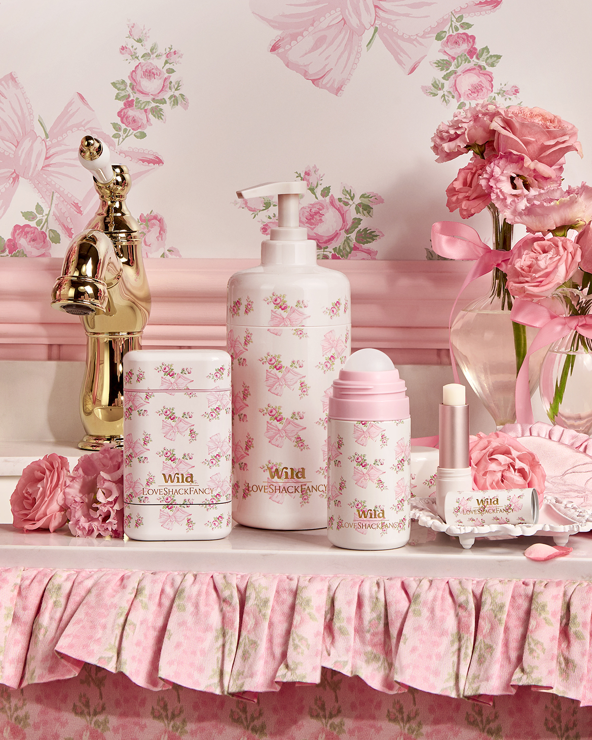 Caption: a table with a lotion bottle, lotion bottle, soap bottle, and