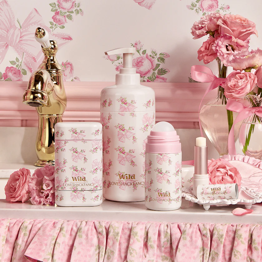Caption: a table with a lotion bottle, lotion bottle, soap bottle, and