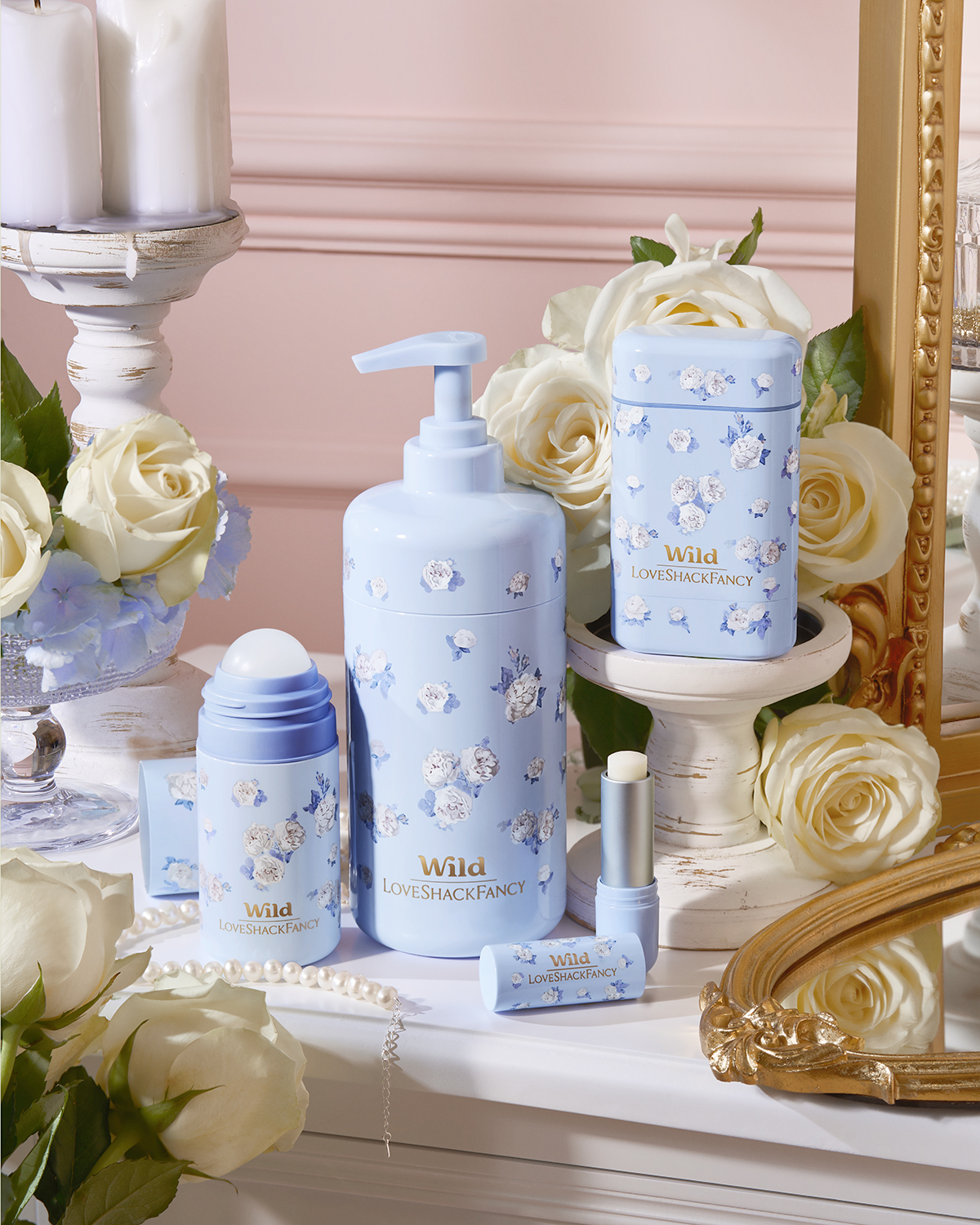 Caption: a table topped with bottles of lotion and flowers