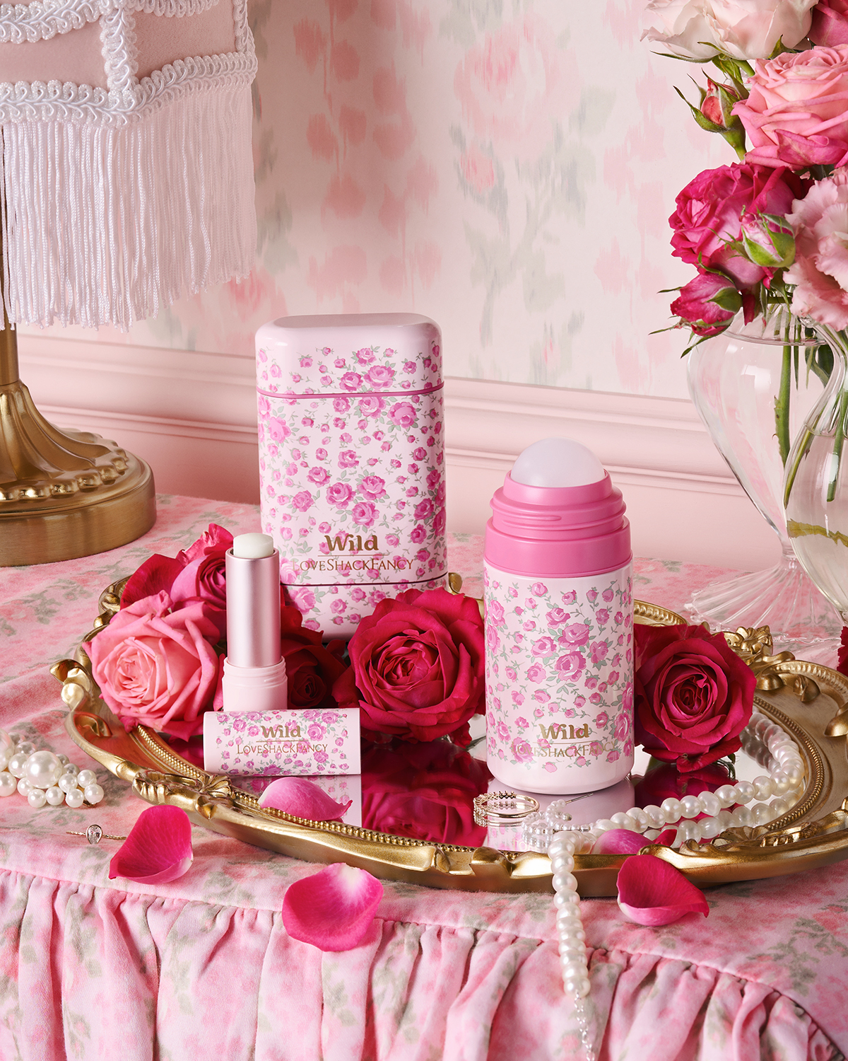 Caption: a tray with pink flowers and lipstick on it