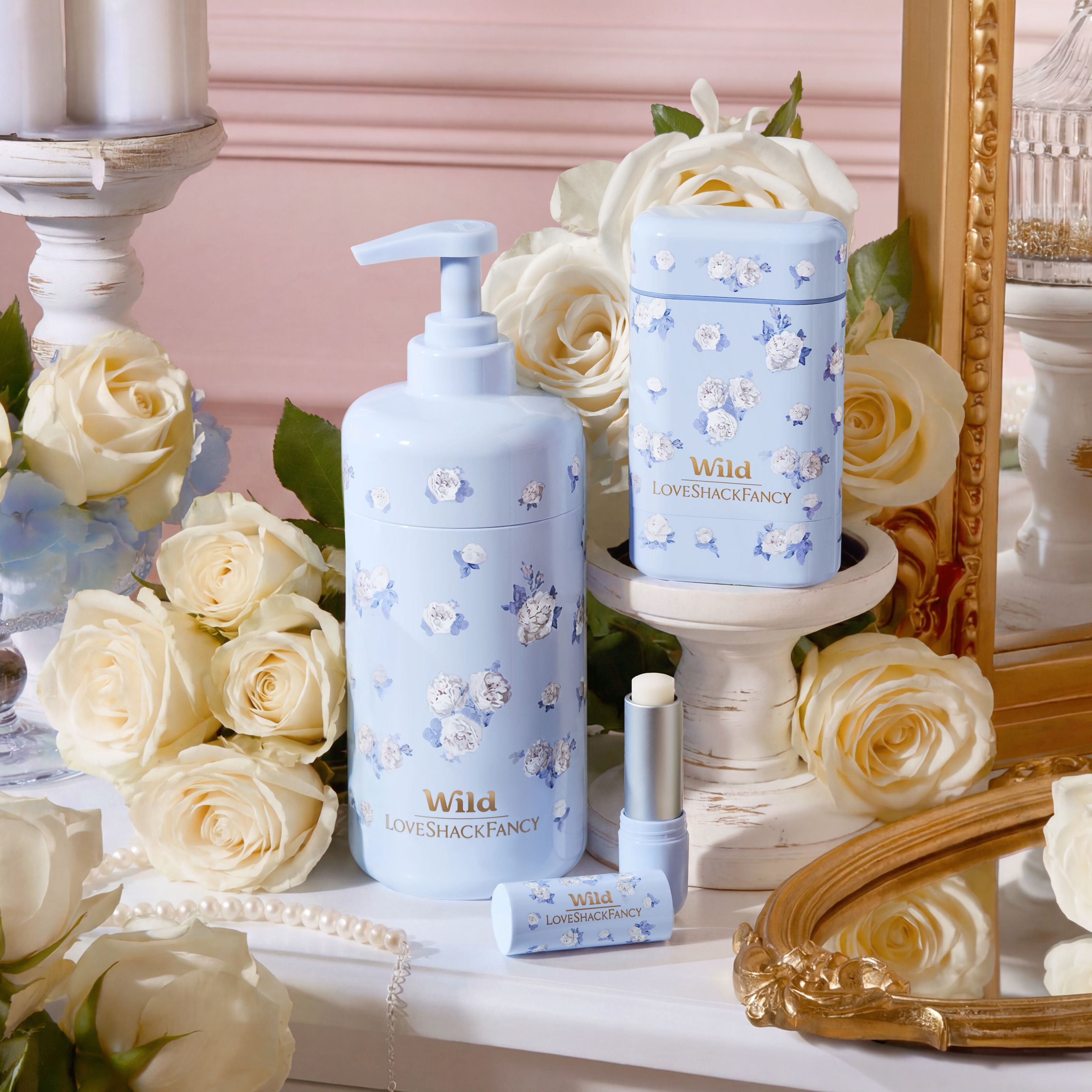 Caption: a table topped with a bottle of lotion next to a mirror