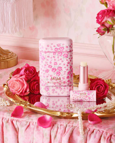 Caption: a pink table with pink flowers and pink lipstick