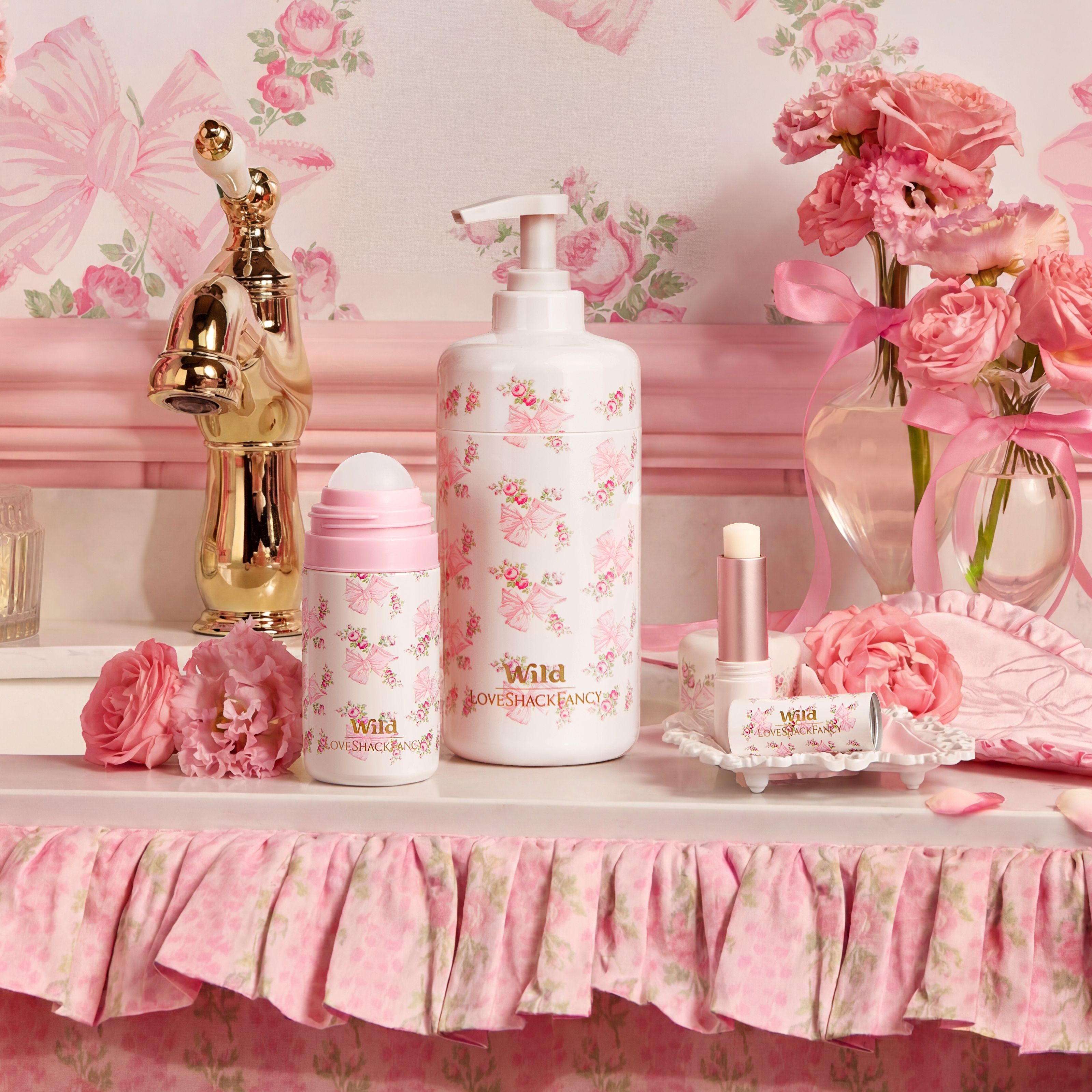 Caption: a table topped with a bottle of lotion next to a vase of flowers