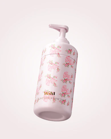 Caption: a pink bottle with a pink flower pattern on it
