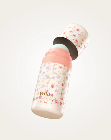 Caption: a pink and white water bottle with flowers on it