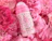 Caption: a pink water bottle sitting on top of pink flowers