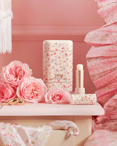 Caption: a pink bedroom with pink flowers and accessories