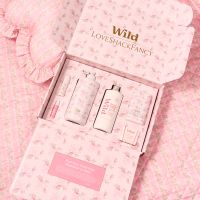 Caption: a pink box with a bottle of lotion and a tube of lotion