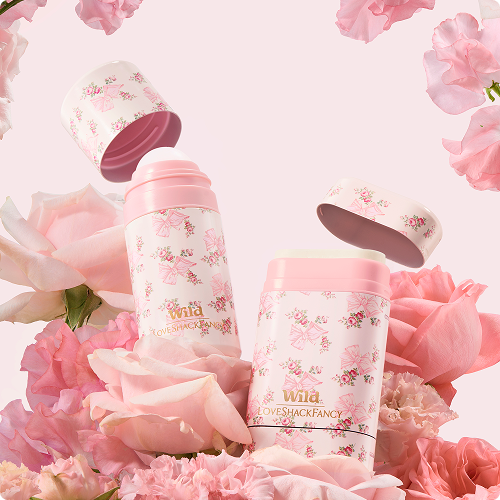 Caption: a pink floral arrangement with a bottle of lip balm