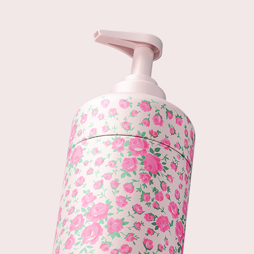 Caption: a close up of a pink and white container with flowers on it