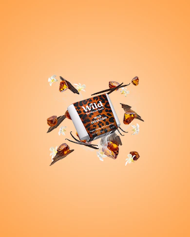 Caption: an orange background with a bunch of birds flying around